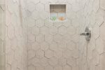 Full bathroom with standing tiled shower
